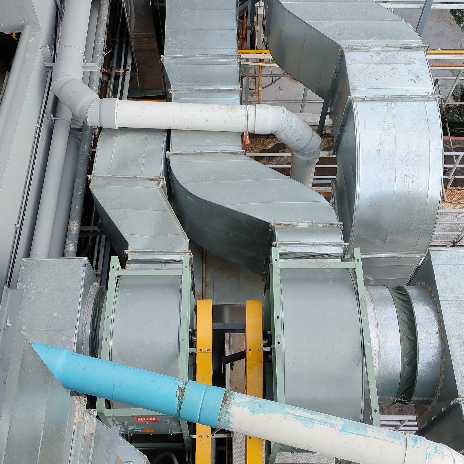 Professional Heating and Cooling technician diagnosing an issue during an AC repair service.